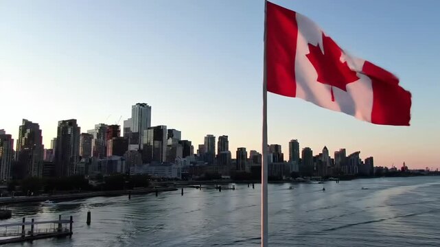 Canadian flag waving near city skyline at sunset, usable for travel and patriotism