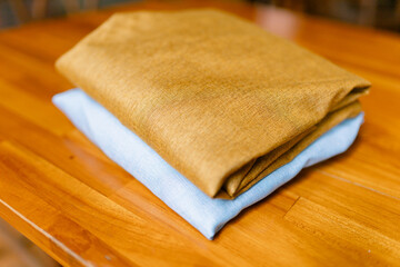 Soft folded fabrics in earth tones offering a cozy and natural texture, perfect for adding warmth to your designs and creating a calming, organic aesthetic