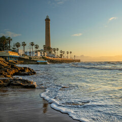 Fototapeta premium Chipiona, Spain. Chipiona Lighthouse on the Ocean Shore. Sea travel and tourism, Atlantic 