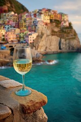 Glass of White Wine on Cliff Overlooking Scenic Cinque Terre Coast, Italy