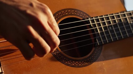 Hands skillfully strum a wooden guitar as warm sunlight paints the beach in golden hues. The air is filled with music, inviting all to enjoy the magic of the moment.