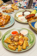 Crispy, double-cooked fried yuca sticks served with spicy cilantro sauce and crumbled queso fresco