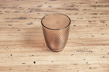 A fine crystal glass with spiral filigree decoration captures the brilliance of the morning light, highlighting each precise cut made by the glass artisan