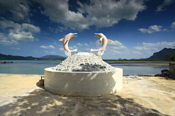 Nakhon Si Thammarat, Thailand- 16 June 2012: Scenery of Ban Laem Prathap Beach, A pier for sightseeing and pink dolphins © kosin_sukhum