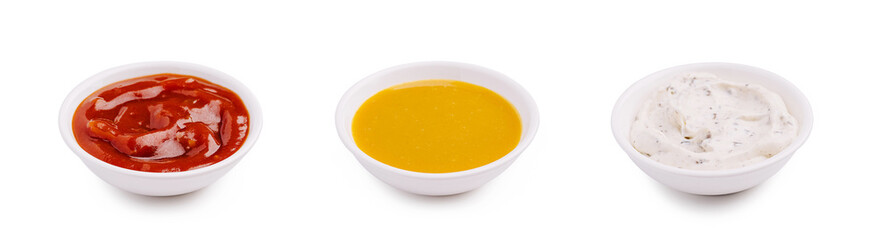 Three bowls of sauce on a white background for dipping and flavoring