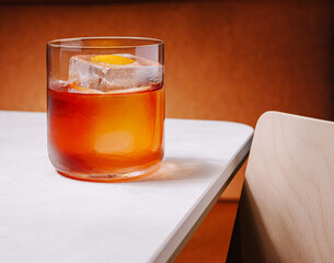 Refreshing cocktail served on a classy table with warm tones