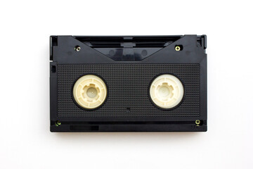 A black VHS tape isolated on white background, representing vintage media storage and playback technology.