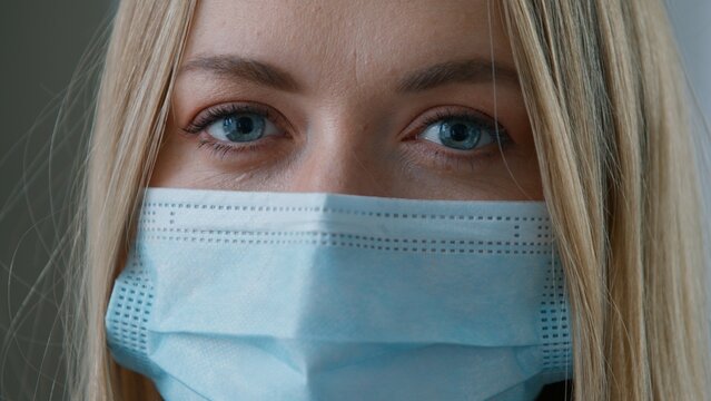 Portrait Caucasian business woman in medical protective face mask looking at camera with businesswoman headshot female girl protection coronavirus covid pandemic ill sick lady doctor surgery nurse