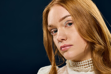 Fototapeta premium Captivating gaze of a beautiful young woman with an elegant style