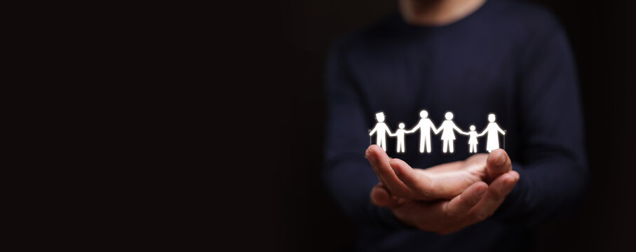 Hands holding a glowing family icon representing protection, mental health support, insurance security, love, unity, care, and families wellbeing.
