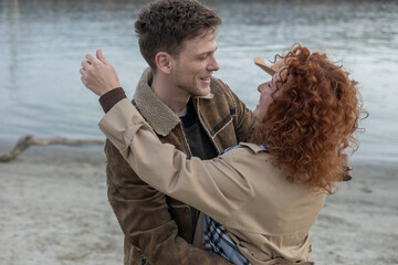portrait of a young man hugging his girlfriend after long distance relationship 