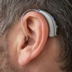 Digital Hearing Aid Worn by an Older Adult
