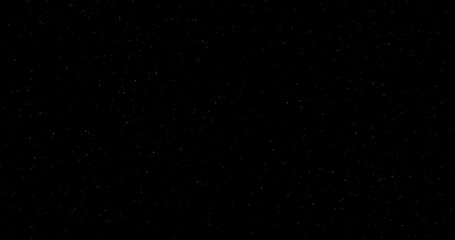 Minimal colorful star-dust on a black background, with tiny sparkling particles and soft shimmering light. Cosmic dust in a clean, simple style.