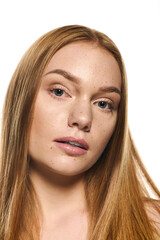 Radiant young woman with striking features exuding confidence and beauty in a bright setting