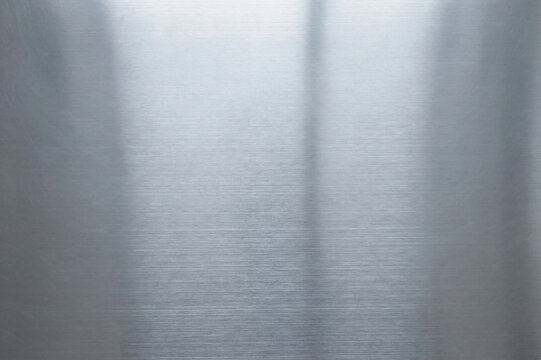 Silver brushed metal texture background with horizontal scratch lines, polished stainless steel surface reflection, Generative A - Powered by Adobe