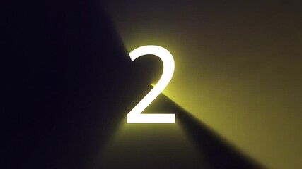 A glowing number four is illuminated by a purple light on a dark background