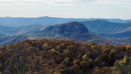 Fall at Shining Rock. The iconic white quartz bald, high in the Blue Ridge Mountains, hides in the blue shadow of this colorful October ridge in North Carolina.