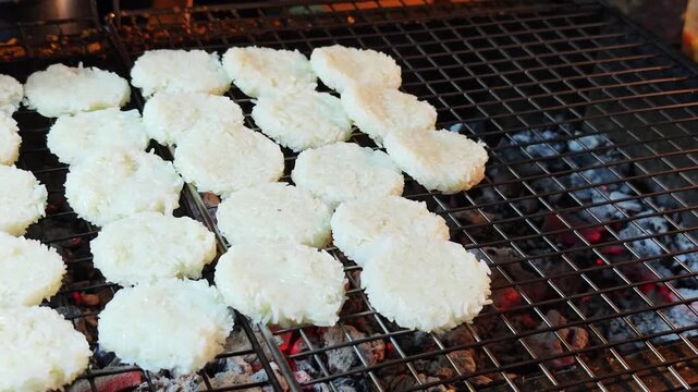 Khao jee: a street style Thai style grill sticky riceon the charcoal turtle with egg paste. 