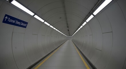 Tunnel Perspective: Descending Path Framed By Illuminated Architecture Visuals