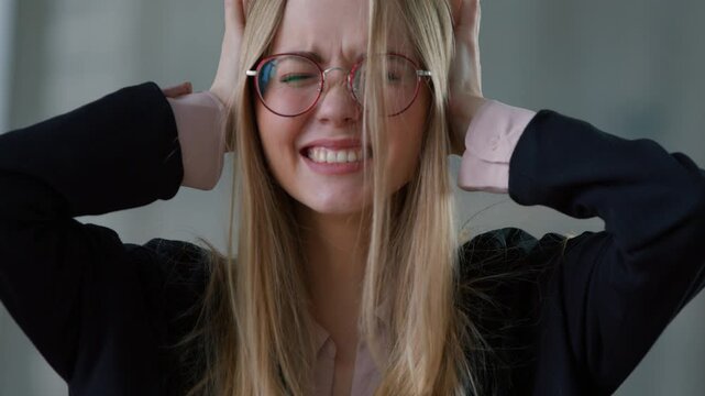 Caucasian stressed business woman holding head shaking no closing ears noise stress in office businesswoman girl female deny reject negative reaction refusing listen disagreement work overload panic