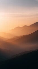 Obraz premium mountain landscape with sunrise and misty valleys, close-up shot, warm earthy hues, premium look, natural daylight, ample space for text, brand-safe, no logos