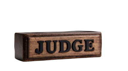 Closeup wooden judge nameplate with engraved bold lettering symbolizing law authority justice courtroom legal profession concept displayed clearly on white background