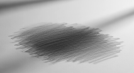 Gray pencil scribbles on white paper, with blurry light shafts