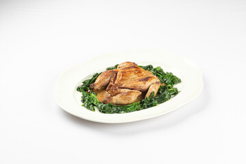 Tender roasted chicken served on a bed of sauteed spinach with light seasoning and herbs