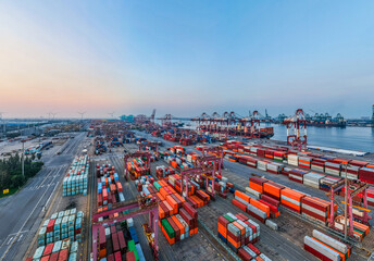 Obraz premium Aerial view of the cargo terminal of Tianjin Port at dusk