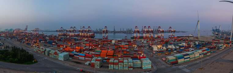 Panoramic aerial view of the cargo terminal of Tianjin Port at dusk