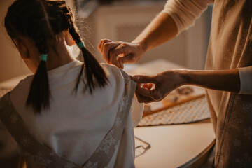 mother and daughter baking christmas cookies