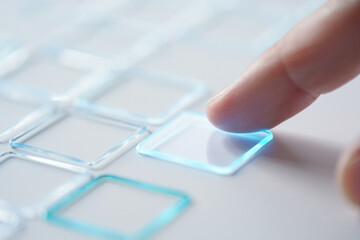 Index Finger Pressing on Transparent Square Border Shape on White Background Close Up 150 Characters