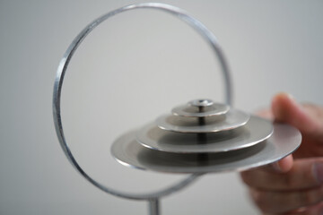Kinetic Sculpture Spinning with Balanced Discs on Metal Stand Held in Hand Abstract Still Life Stationary Design Rotating Moving Motion