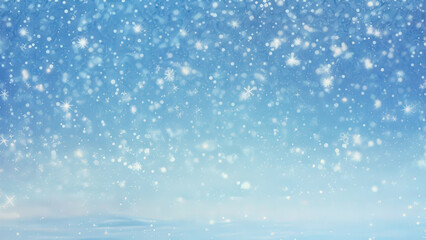 Fototapeta premium Snowflakes Gently Falling Against a Bright Blue Sky During a Winter Day
