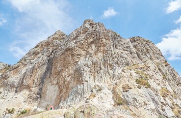 Fototapeta premium The 430 m high volcanic plug Pena de Bernal, which is also surrounded by a charming Pueblo Magico