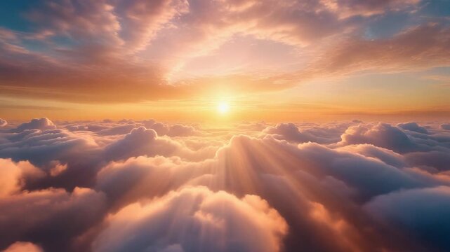 Golden sun rising over heavenly clouds