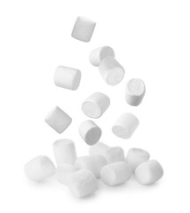 Fresh mallows falling onto heap on white background