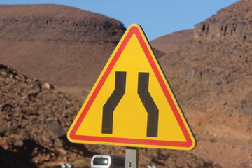 Road narrowing ahead warning sign