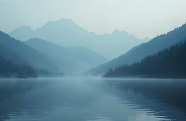 Misty mountains emerge from calm lake water. Dense forest covers slopes, shrouded in morning fog. Serene blue landscape, remote wilderness scene, peaceful dawn light.