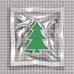 A vibrant green Christmas tree emblem sealed in clear plastic packaging on a subtle checkered gray background, evoking holiday cheer and festive preparation