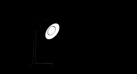 A single bright lamp shining in the darkness.