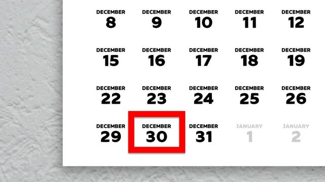 The date December 30th marked with a red cursor on the wall calendar 2025