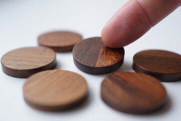 Arranging Dark Brown Wooden Discs Represents Choice Selection Decision Making Strategy and Game Conceptual Photography