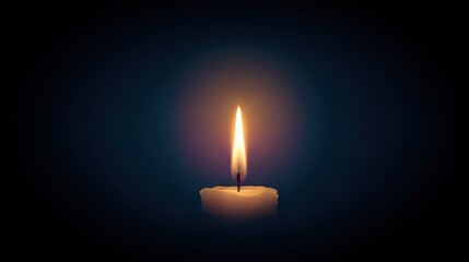A single candle flame burning brightly against a dark background