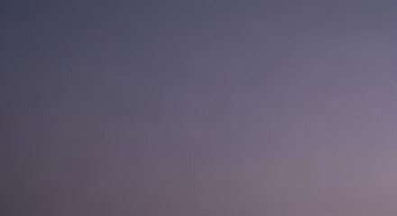 Subtle gradient background in shades of purple and blue creating soft tranquil atmosphere.