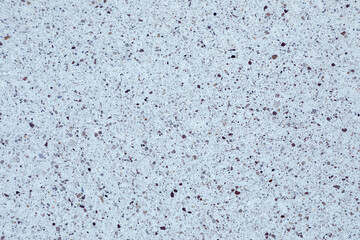 Terrazzo featuring scattered natural stone chips delivers a stylish, nature-inspired texture ideal for contemporary design and clean backgrounds.