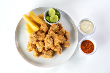 Peruvian food: chicharron de pescado or fish cracklings. White background