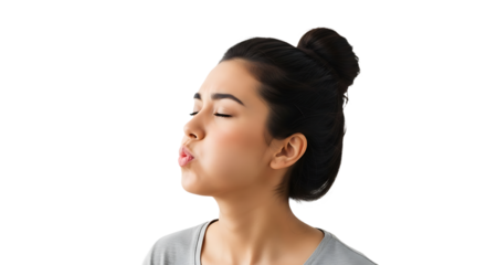 Young woman blowing a kiss isolated on transparent background, with her eyes closed and her lips pursed, expressing love and affection