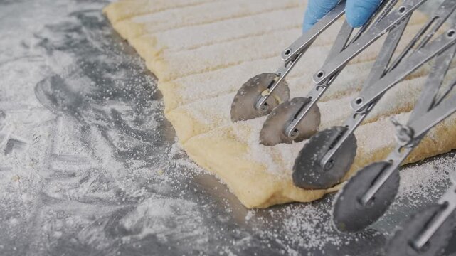 Cutting Cookie Dough With Pastry Wheels. Bakery production
