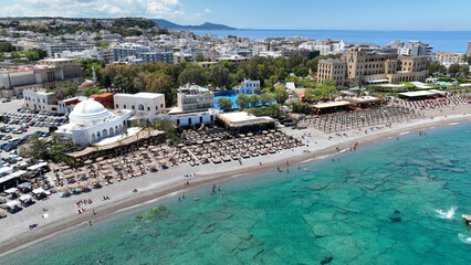 Aerial drone photo of popular sandy organized beach of Elli famous for restaurants and bars near main town of Rhodes island, Dodecanese, Greece